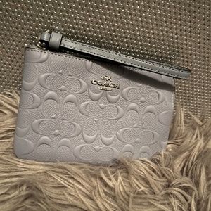 Sky-blue Coach Wristlet